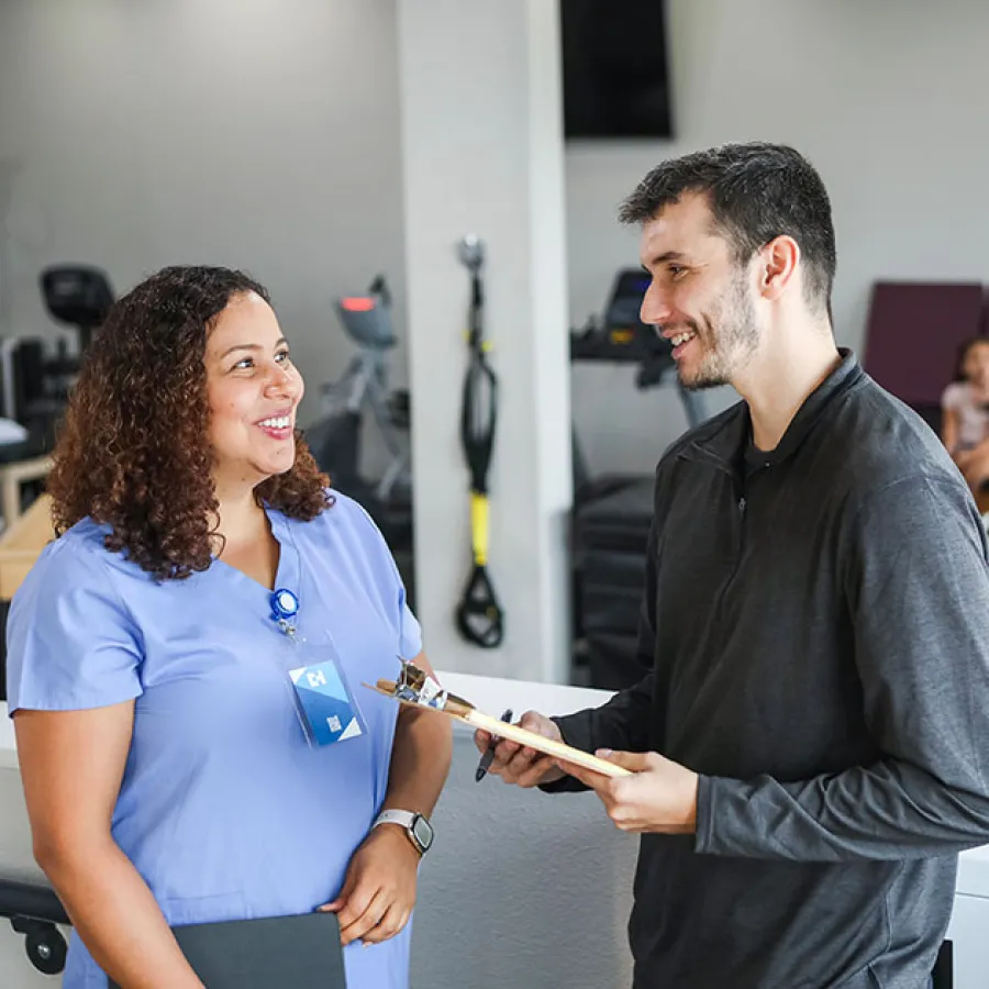 ICA surgeon and therapist reviewing a post-op protocol