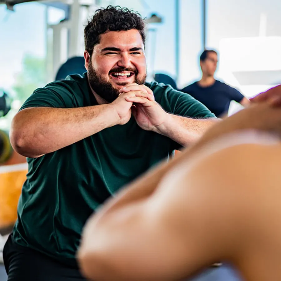 Therapist and worker reviewing weekly progress numbers