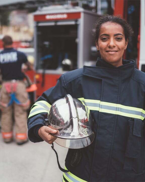A person driving a passenger bus